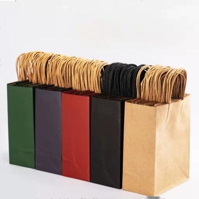 China Recycled Materials Custom Printed Paper Gift Bags Kraft Paper Tote Bags Garment Packaging Bags for sale