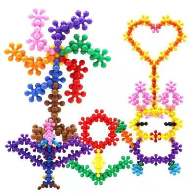 China Eco-friendly three-dimensional rotating plum flower of ABS injection molding 3D building block diy toys for early childhood education in kinderg for sale