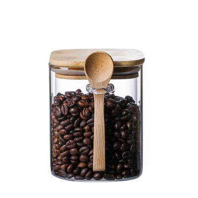 China Freshness Preservation Square 1000ml Bamboo Lid Coffee Bean Storage Glass Jar For Food Or Candy With A Spoon Glass Jar for sale