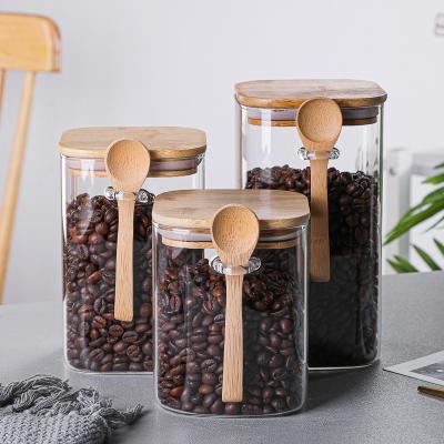 China Transparent Glass-Glass Storage Jar With Lid Wooden Storage Bottles Kitchen Storage Jars for sale