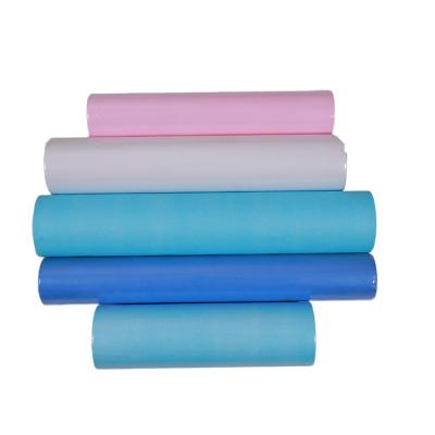 China Disposable Medical Dental Bib Mix Roll Of Paper Plastic Sheet + PE Film Paper 100pcs/roll for sale