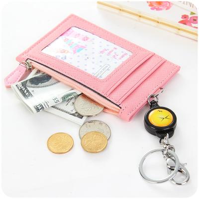 China Vintage Smile Face PU Key Chain ID Card Holder Student School Bag Pendant Leather Retractable Card Holder Key Chain for sale