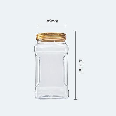 China 960ML Food Hand Type Clear Square Jars With Screw Lids Gold Plastic Container For Nuts Packing for sale