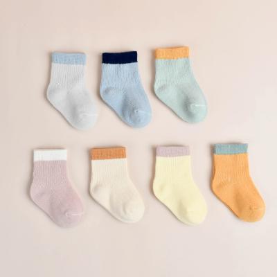 China QUICK DRY cartoon striped infant organic cotton baby thongs candy color thin combed cotton baby socks for sale