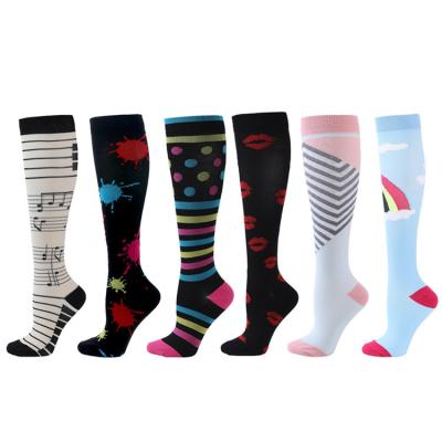 China 2021 wholesale QUICK DRY socks women's and men's compression sports four seasons cotton custom logo socks for sale