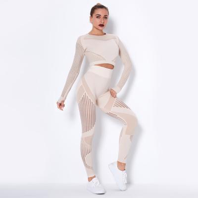 China Breathable goods in stock! European and American Seamless Yoga Moisture Cavity Suit Absorption Long Sleeve Yoga Clothing Sports Fitness for sale