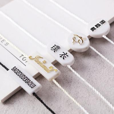 China Sustainable Plastic Seal Hang Tag BulletHead Seal Hangtag String Plastic Hang Tag String For Garment for sale