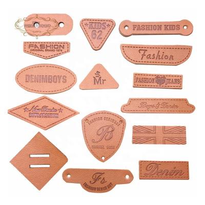 China Sustainable Wholesale Design Custom 3D Name Logo Embossed Genuine Leather Patches and Labels for Bag and Garment for sale