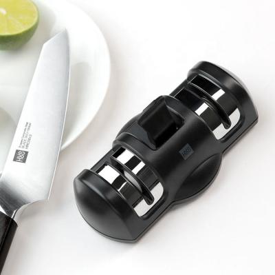 China Viable Creative Kitchen Accessories Knife Sharpening Tool Suction Ceramic Knife Sharpener System for sale