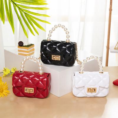 China 2021 New Niche Women's Designer Pearl Portable Candy Daily Color Small Square Jelly Purse Bags Portable Handbags for sale