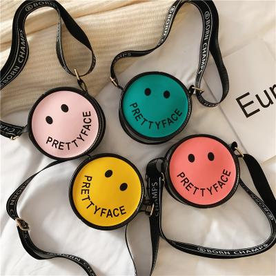 China Daily 2021 Shape New Designer Children&'S Smiley Face Messenger Coin Change Cute Mini Round Purse Bags for sale