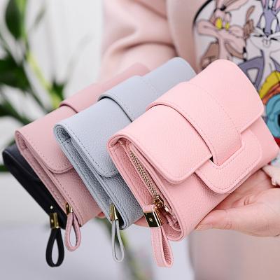 China 2021 Litchi Multi-layer Waterproof Fashionable Short Pattern Multi-Layer Buckle Triple Wallet for sale