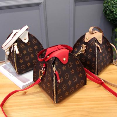 China Daily 2021 Newest PU Ladies Women Fashion High Quality Leather Handbags Luxury Shoulders Pinch Triangle Handbags With Price for sale