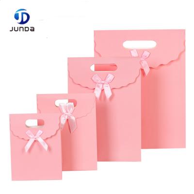 China Disposable Wholesale Best Selling Luxury Cheap Fancy Wedding Rose Gift Paper Bags With Handles for sale