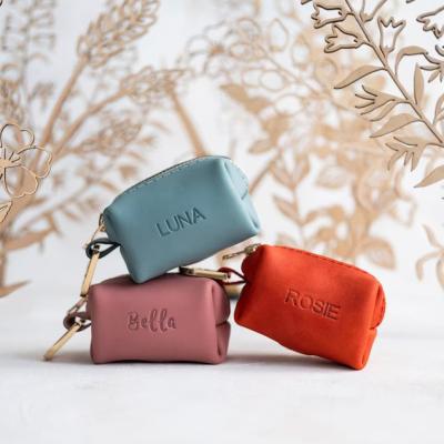 China Durable Custom Genuine Leather Pet Dog Poop Bag Portable Waste Carrier Dispenser Cute Holder With Metal Clip for sale