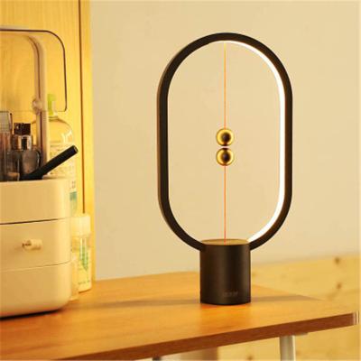 China Creative Modern Magnetic Pendant Lamp LED Balance Table Lamp Night Light Bedroom Bedside Lamp USB Red Creative Battery Charging for sale