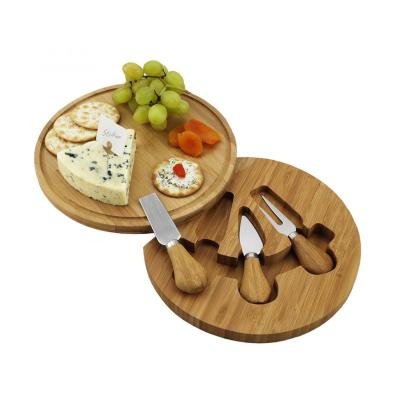 China Sustainable bamboo cheese board with stainless steel cheese knife, rotatable, with storage knife box in the middle for sale