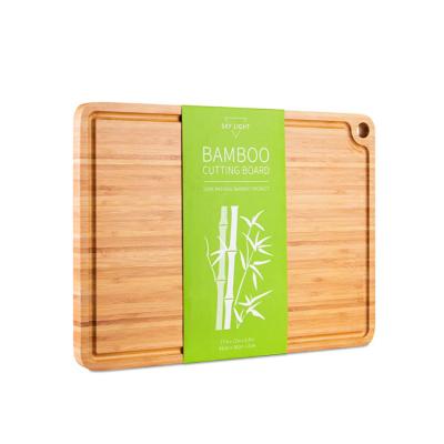 China Sustainable bamboo cutting board with juice bowl, suitable for meat, cheese, fruits and vegetables for sale