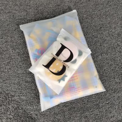 China Recyclable Eco Friendly Custom Logo T-shirt Zipper Lock Packaging Frosted Plastic Bags For Clothes for sale