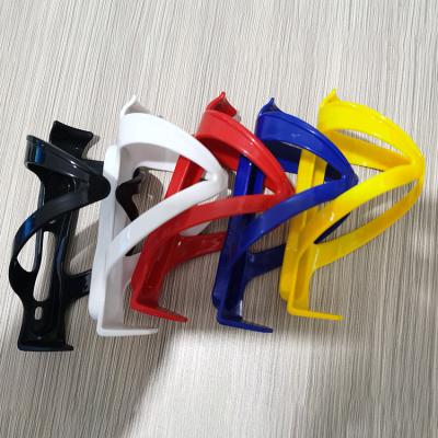 China Plastic PC Bicycle Water Bottle Holder Mountain Bike Water Bottle Holder Bike Water Cup Holder Thickened Plastic Mount Parts for sale