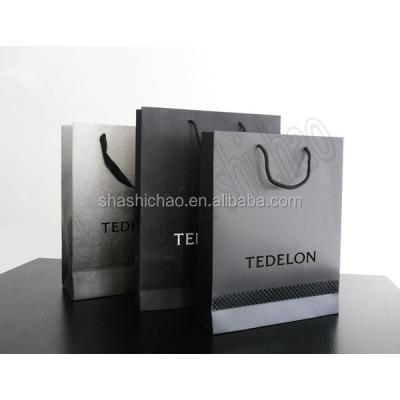 China BIODEGRADABLE Customized Logo Printing Paper Bag With Glossy Finish for sale