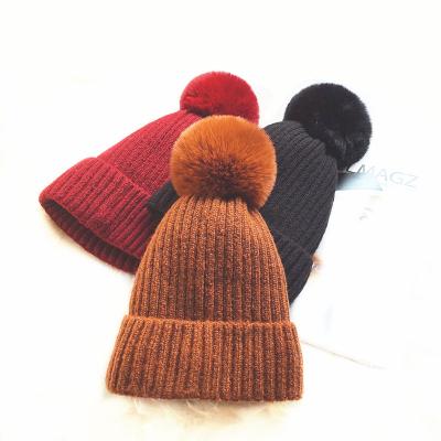 China JOINT Sports Custom Design City Cuff Winter Beanie Knit Pom Pom Beanie Hat Cap for sale