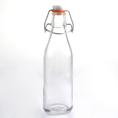 China Sustainable 10oz Round Milk Bottle Oil And Vinegar Glass Bottle With Stopper Whiskey Decanter for sale