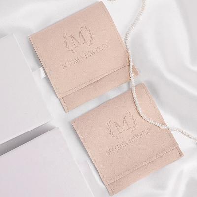 China Jewelry Customize Microfiber Cloth Wrap Luxury Small Jewelry Packaging Pouch Microfiber Bag With Enbossed for sale