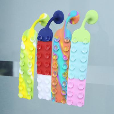 China Eco-Friendly Kids Pops Silicone Acupressure Relieve New Design Squidpop Anxiety Sensory Toys Squidopops Sissy Person Suction Antistress for sale