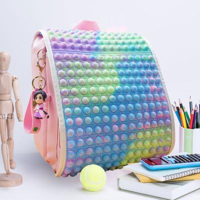 China New Trendy Stylish Fashionable Waterproof Girl Rainbow Color Push Bubble Noise Backpack Busker School Teenage Schoolbag For Kids for sale