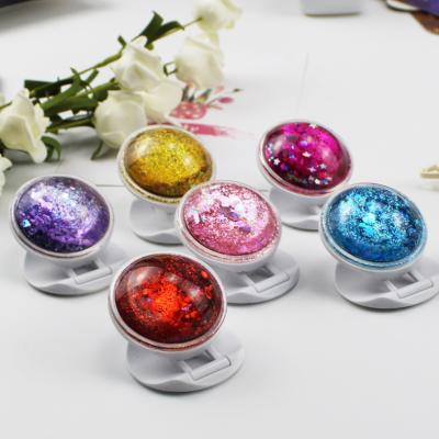 China Luxury Adjustable Ring Grip Foldable Stand Stars Glitter Quicksand Phone Holder for Smartphones and Tablets Iphone Mobile Phone for sale