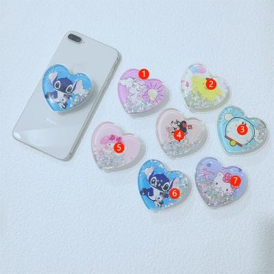 China Adjustable Wholesale Custom Quicksand Liquid Heart Plug Phone Holder for sale