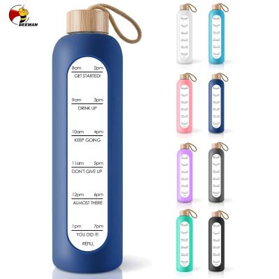 China Beeman Sustainable Cute Sports Online Reusable Colorful Frosted Glass Water Bottle With Silicone Sleeve for sale