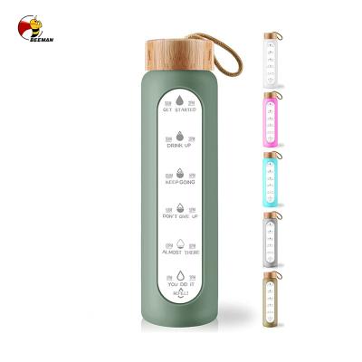 China Viable Gradient Wooden Filter Lid Beeman Bamboo Water Bottle With Time Marker With Time for sale