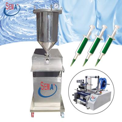 China Semi-automatic vertical food syringe filling machine and syringe labeling machine for sale