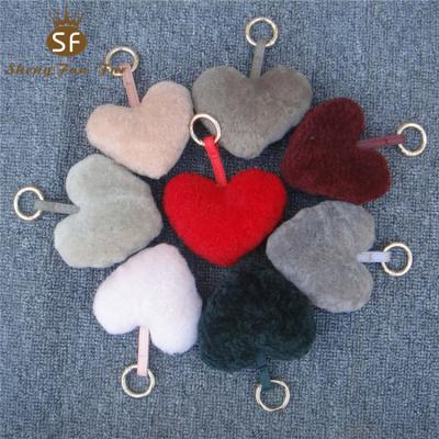 China Main Sale Fluffy Sheep Shear Heart Shape Fur Pom Poms Wholesale Warm Fluffy Ball Chain Pendant With Custom Color for sale