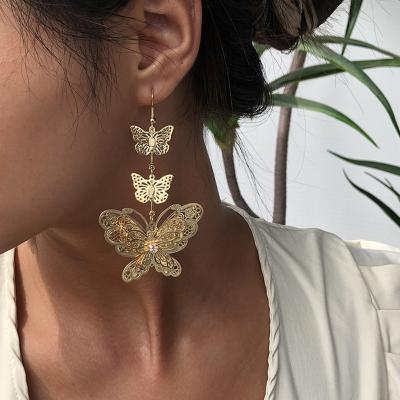 China Fashion Punk Stud Earrings Shape Jewelry Hollow Butterfly Long Gold Dangle Earrings Bridesmaids Young Girls Earrings for sale