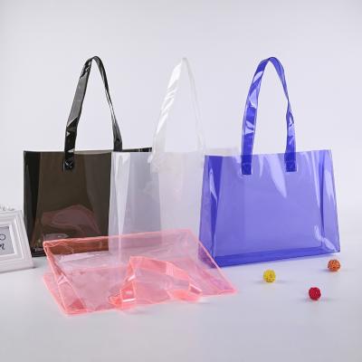 China Custom PVC Jelly Bag Clothing Shopping Tote Transparent Logo Large Capacity Plastic Fashion Handbag for sale