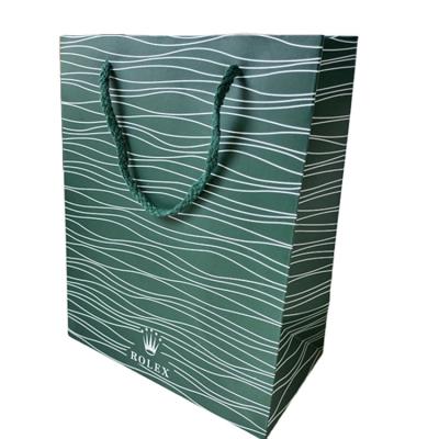 China Handmade matte pattern printing stock popular green coated paper role bag wholesale for watch box packaging for sale