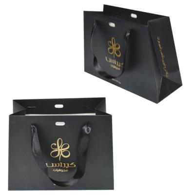 China Cheapest jewelry packaging to reuse unique fashion black art jewelry paper bag packaging with ribbon for sale