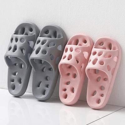 China New Fashion Trend Personality Fashion Massage Hollow Out Thick Bottom Shower Home Slippers For Couples Men Women Flip Flops for sale