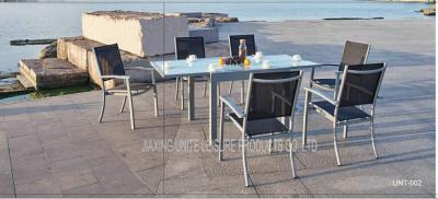 China Modern Style Metal Patio Table And Chairs 7 Piece Patio Set With Textilene Fabric for sale