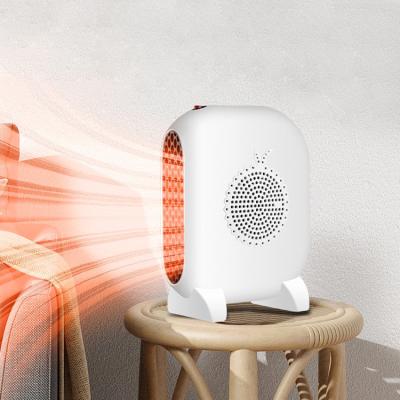 China Fashion Hot Air Temperature Controlled Home Standing Fan 800W Portable Electric Desktop Heat Powered Stove Fan Heating Indoor Small Heater for sale