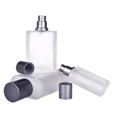 China Free Samples Luxury 30ml 50ml 100ml Personal Care Frosted Pole Flattened Shape Mist Spray Glass Perfume Bottle With A Silver Aluminum Cap for sale