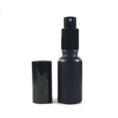 China Oil30ml 50ml Cosmetic Essential Matte Black Serum Pump Sprayer Lotion Glass Perfume Bottle With Paper Tube for sale