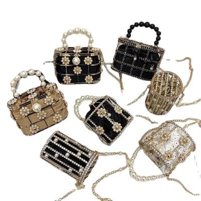 China Cotton polyester 2020 French minority women bag pearl diamond birdcage crystal cross-body set bag for sale