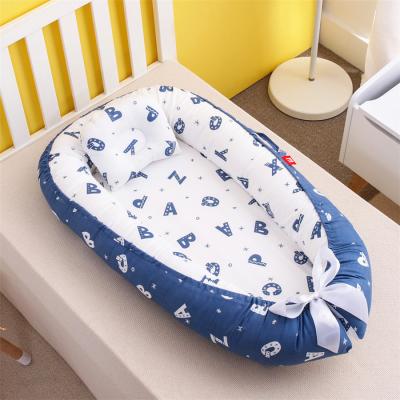 China Portable Nest 100% Organic Cotton Eco-Friendly Baby Materials Baby Bed Ultra Soft Newborn Sofa Braided Baby Nest for sale