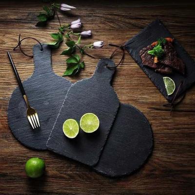 China Western Neutral Stone Slate Tableware Sushi Plate Stocked Irregular Black Steak Food Serving Dish for sale