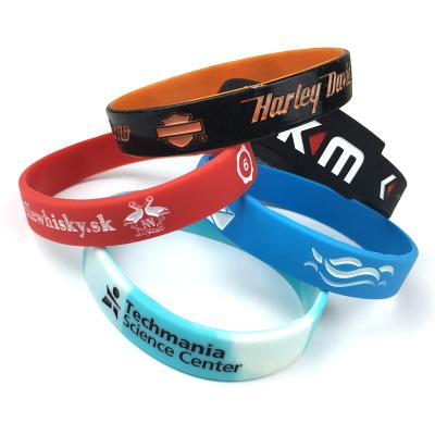 China FASHIONABLE Debossed Sports Fitness Silicone Wristbands Fill Color Logo Basketball Silicone Wristbands Baller for sale