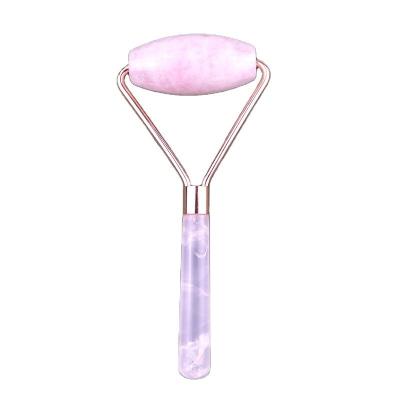 China Roller de masaje de cara de cuarzo rosa natural Gua Sha Jade Roller para la cara terapia antienvejecimiento color rosa masajeador facial en venta